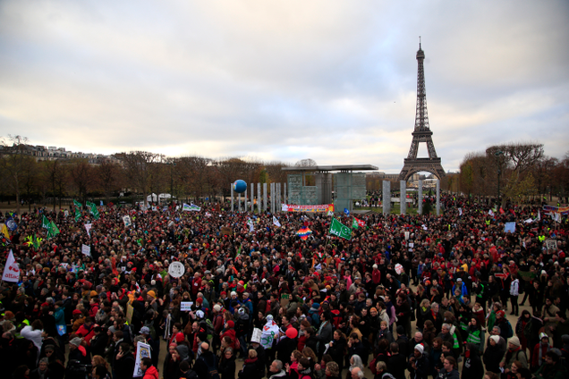 Activists gathered near the Eiffel tower last December to draw attention to populations threatened by climate change as the Paris climate talks were underway. Photo: AP